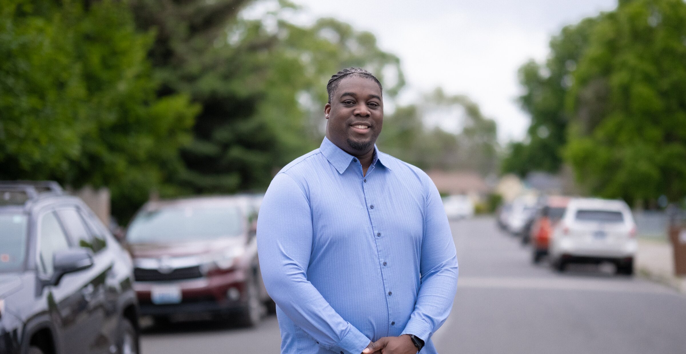 Luc Jasmin III standing on a residential street in Spokane